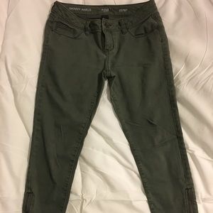 Olive green, mid-rise jeans.